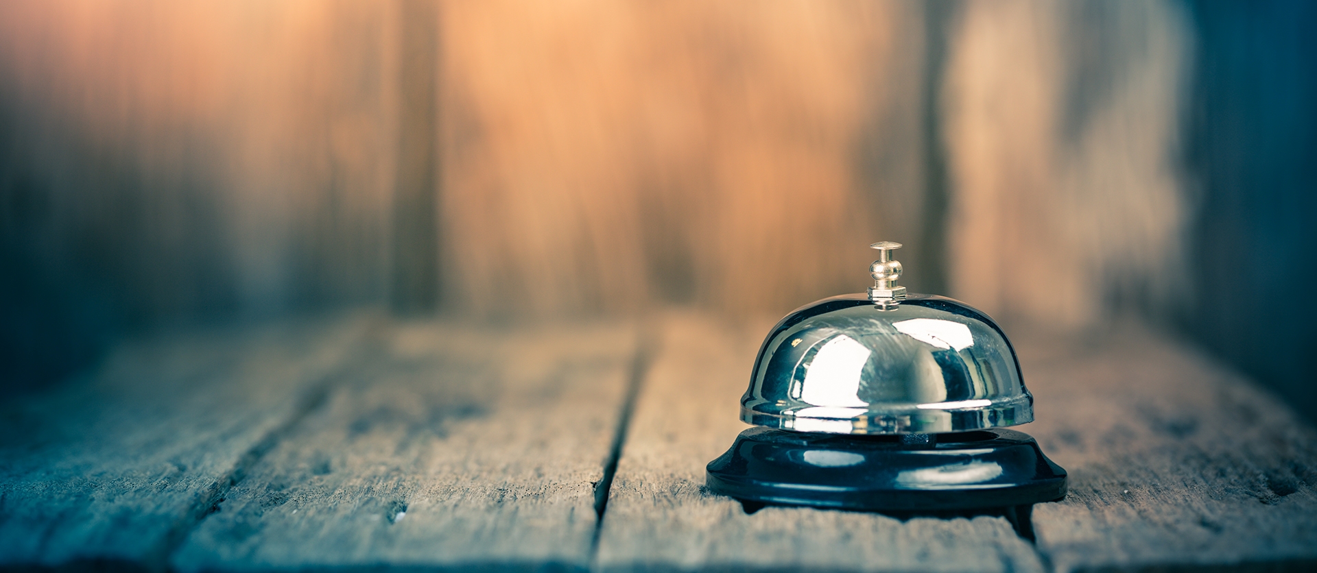 bell on a wooden table